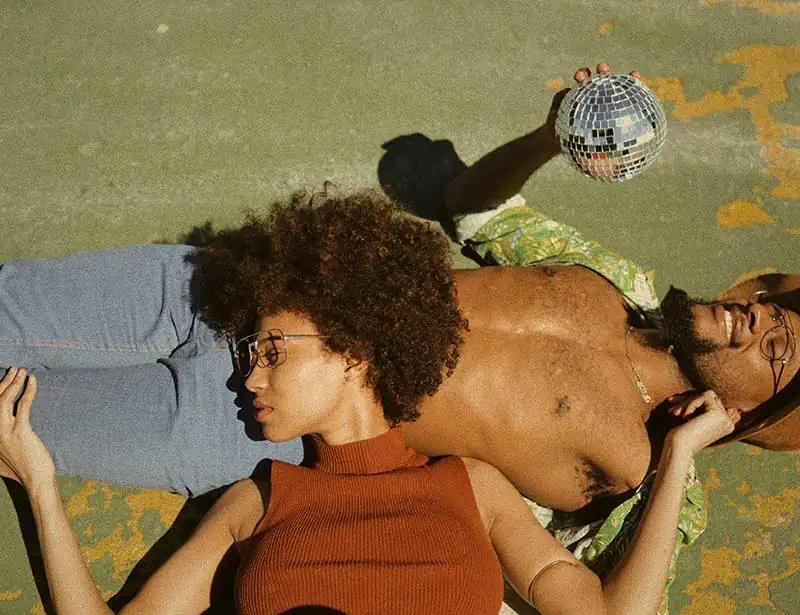 Boyfriend and girlfriend lying outside