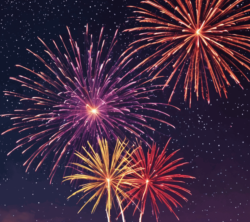 Colorful fireworks forming the letter J against a starry night sky.