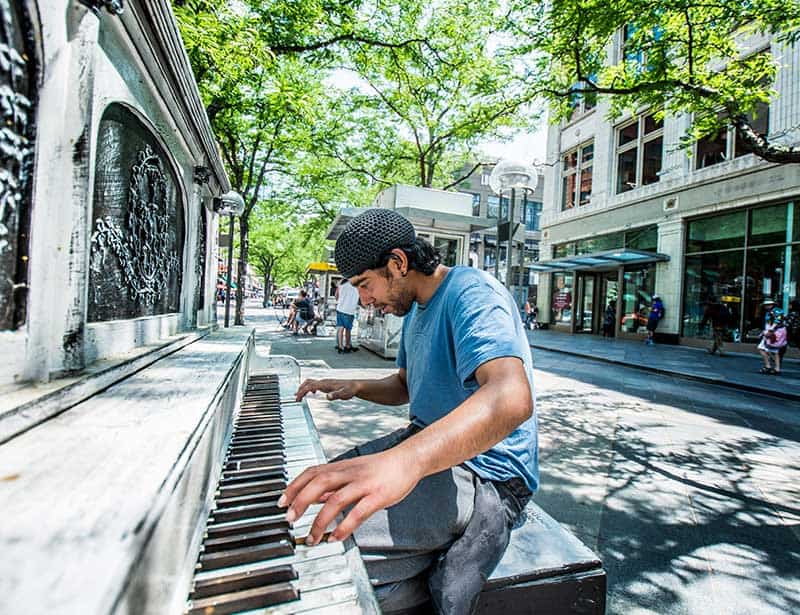 An improv performance by a street pianist