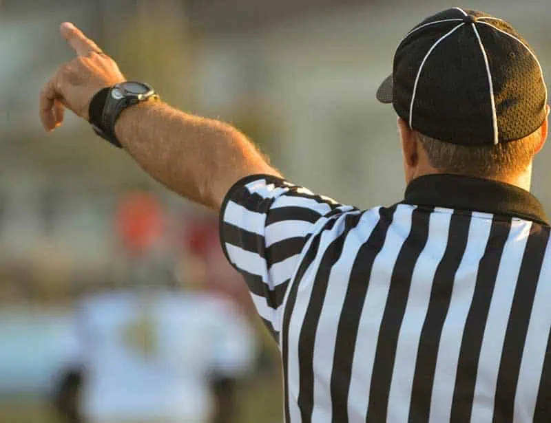 A referee keeps the score
