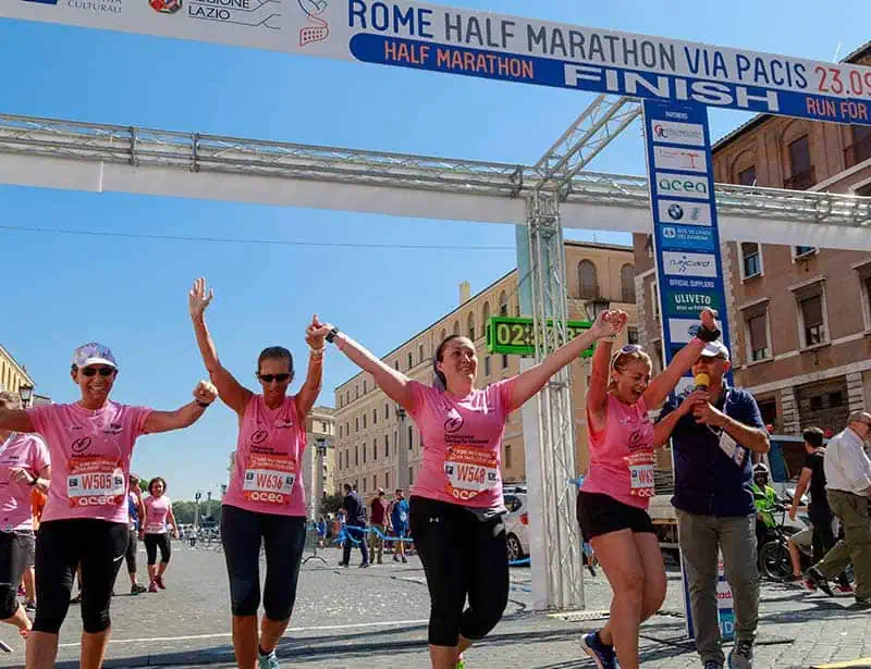 Acheivement -Women crossing the line of a half marathon