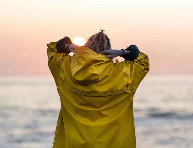 person wearing yellow raincoat