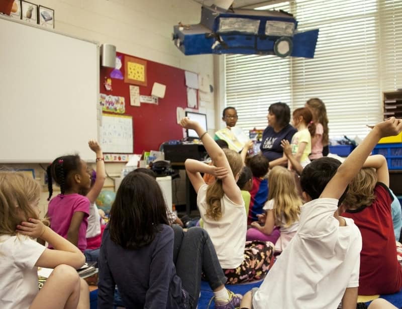young children listening and participating during class