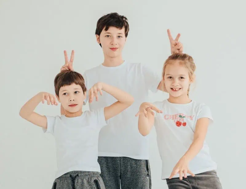 two-brothers-and-sister-show-goofy-poses