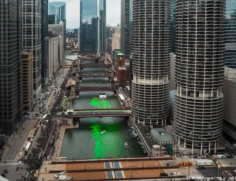 bright green dye slowly spreading in chicago river