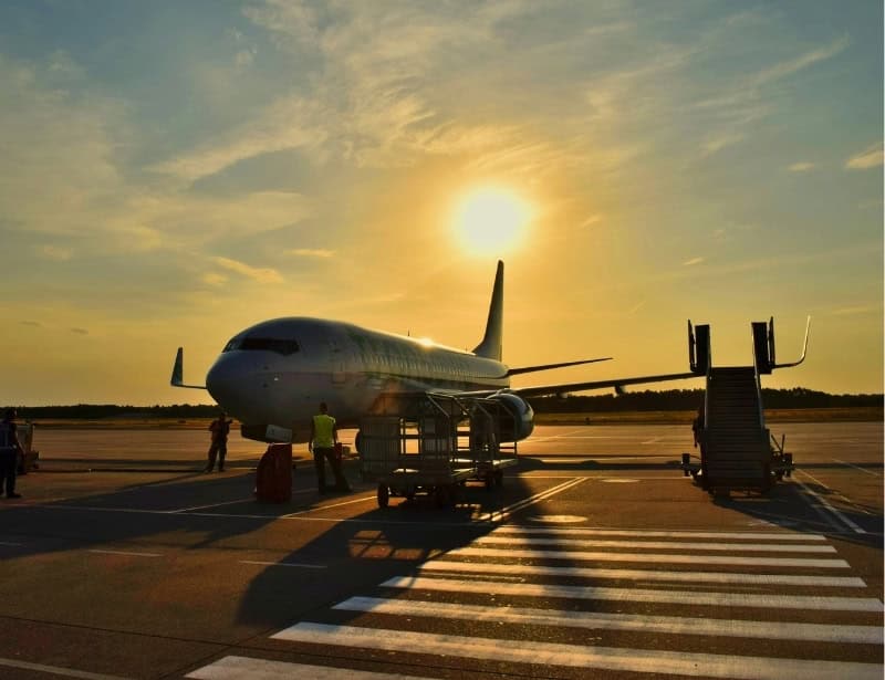 parked civilian plane on sunny day golden hour 