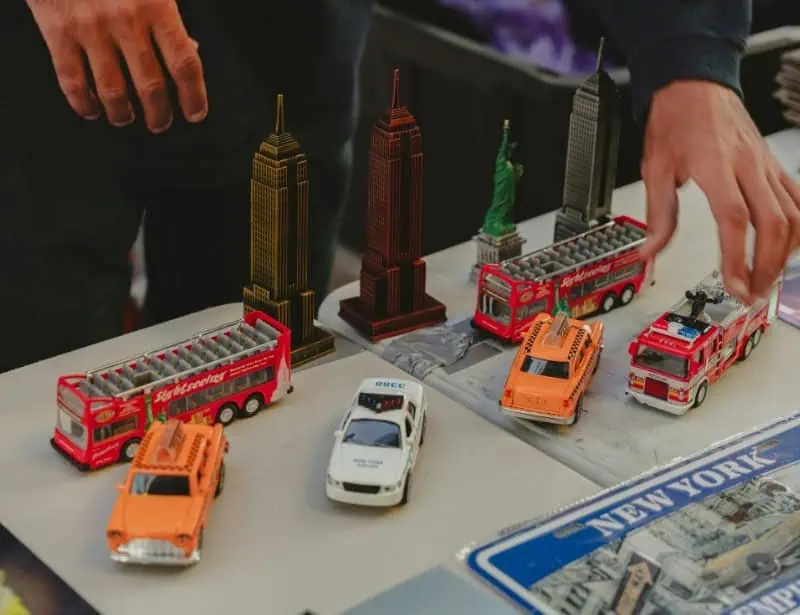 toy souvenirs of new york bus taxi police car firetruck empire state building and statue of liberty