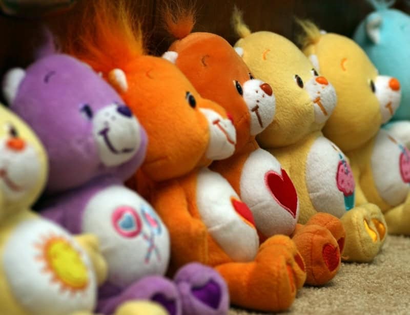 line of various colored care bears