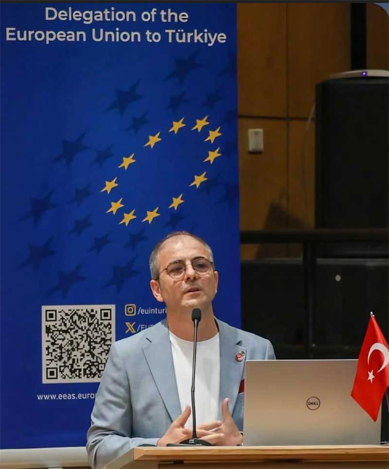 Dr. Nusret Demir speaking at an EU panel